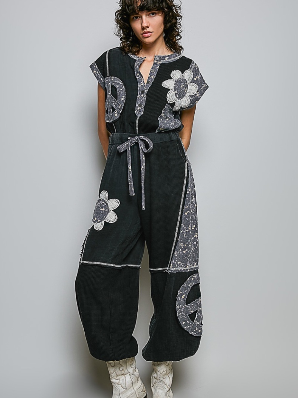 "The Kia" Black Patchwork Flower Peace Sign Jumpsuit